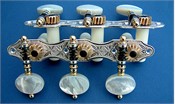 L179: Hauser style engraved sterling silver side plates, light mop oval buttons, cream colored rollers